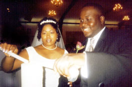 Newlyweds Dismah and Maria King light the Unity Candle.